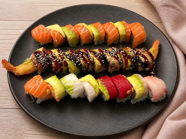 Three special rolls on a plate at Sakura Express
